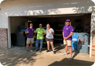 Double Move moving team standing with happy customers after completing a professional moving service