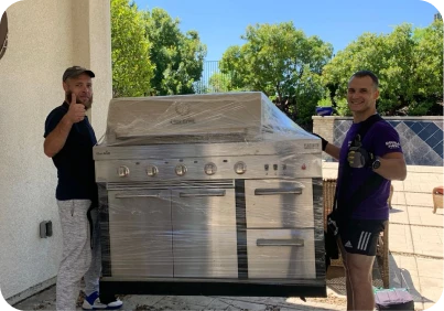Double Move movers carefully loading professional kitchen equipment into a moving truck during relocation service in Sacramento