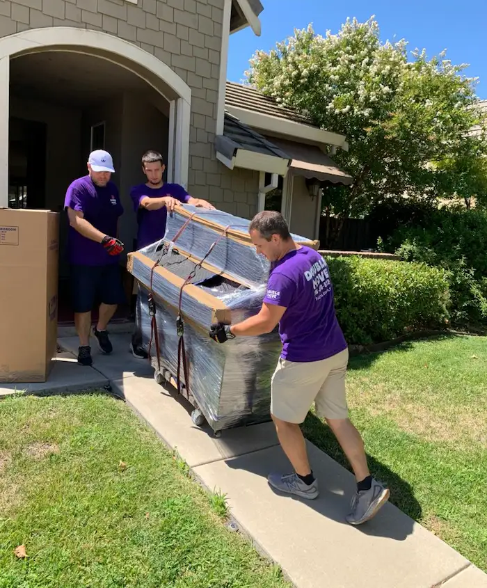 Double Move crew wrapping furniture during a Fair Oaks house move.