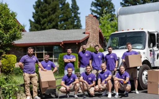 Double Move moving team standing by a truck with packed boxes during a professional photoshoot in Sacramento